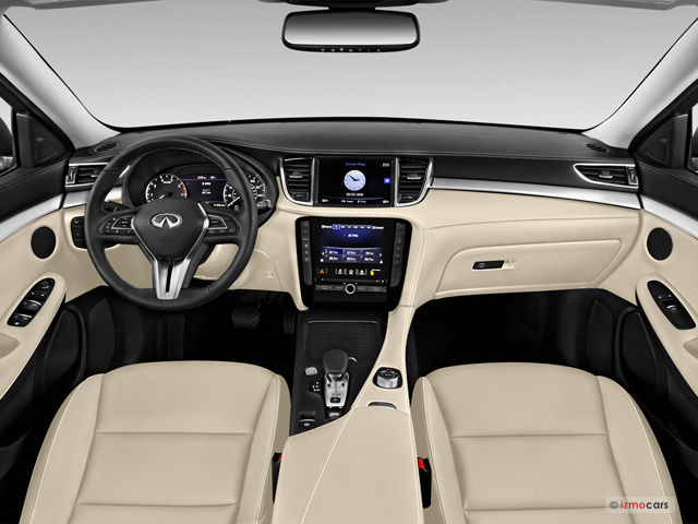 interior of a QX50 sport with cream colored seats, only shows the driver and passenger seats